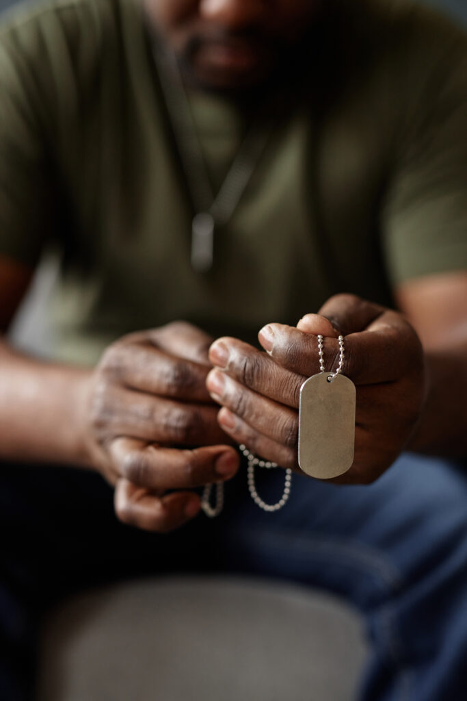 man holding military dog tags